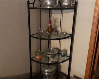 Corner display shelf with 4 shelves highlights a few vintage kitchen items. 
