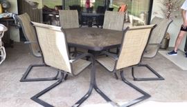 Black Metal/Glass Top Octagonal Patio Table w/ 6 Rocking Armchairs