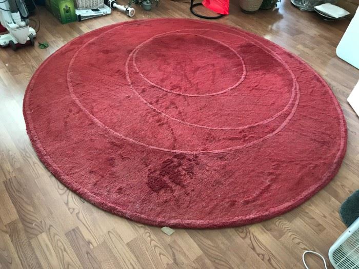 Red round area rug