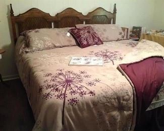King size headboard, frame, King Koil mattress set.  Very nice comforter, dust ruffle, pillow shams and decorative pillow.