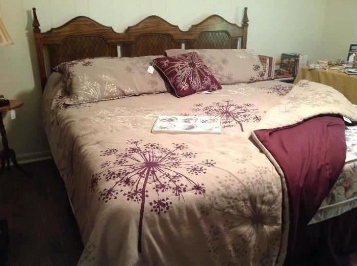 King size headboard, frame, King Koil mattress set.  Very nice comforter, dust ruffle, pillow shams and decorative pillow.
