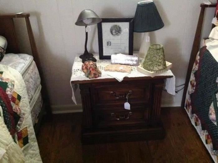 Two drawer nightstand, vintage lamps - the one on the left is an antique desk lamp, vintage hand croucheted tablerunner