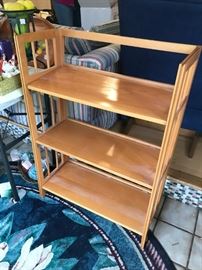 #102 wood folding bookcase 3 shelves $75.00
