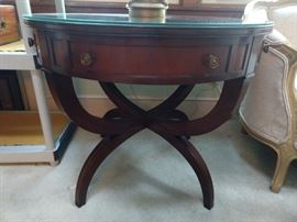 One of a pair of beautiful, vintage mahogany drum tables with two drawers and tooled leather tops, with protective glass.