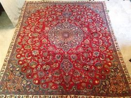 Vintage hand woven Persian Meshad rug, 100% wool face, measures 9' x 8'.