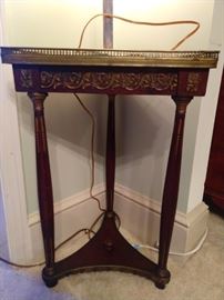 Antique French triangular corner table, with bronze mounts and brass gallery.