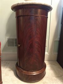 Antique French cylinder form cabinet, with single door, white marble top.