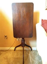 This table doesn't actually plug in, but this pic makes it appear to be so. It's one of a pair of antique mahogany 3-legged (lucky you!) tilt-top side tables.