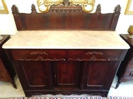Wonderful Victorian mahogany sideboard, with white marble top, carved backsplash, two drawers and three doors.