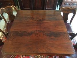 Beautifully veneered mahogany top of the table.