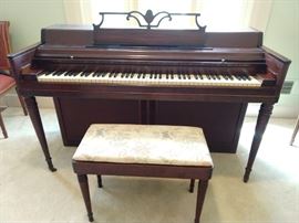 Vintage 1953 Wurlitzer Spinet mahogany piano, with matching piano stool; serial # 534977.