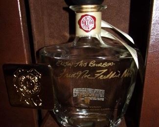 Empty, signed liquor bottles.