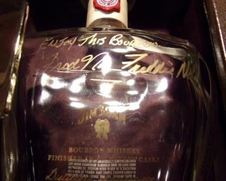 Empty, signed liquor bottles.