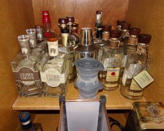 Empty, signed liquor bottles, some in boxed sets.