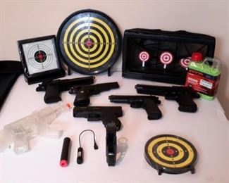 Six airsoft pistols, with targets and pellets.