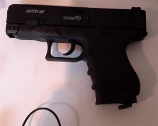 Six airsoft pistols, with targets and pellets.