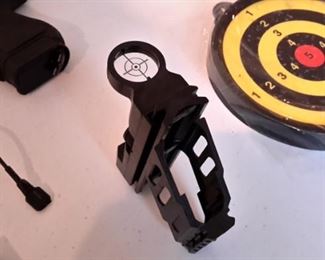 Six airsoft pistols, with targets and pellets.