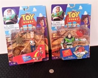 Toy Story Woody and Buzz Lightyear action figures, new in box.