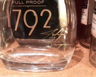 Empty, signed liquor bottles.