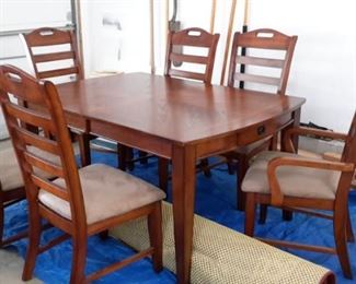 Stunning table top dining room table with drawer and 6 ladder back chairs(2 are captain)