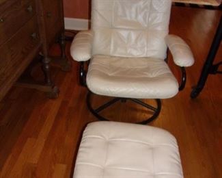Cream colored leather swivel chair and ottoman, in great shape.