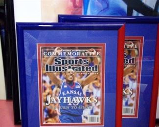 Framed Jayhawks Sports Illustrated covers.