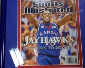 Framed Jayhawks Sports Illustrated covers.