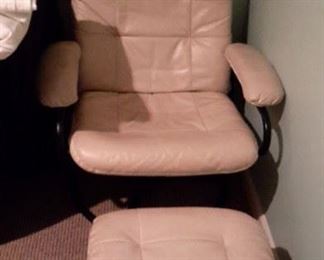 Cream colored leather swivel chair and ottoman, in great shape.