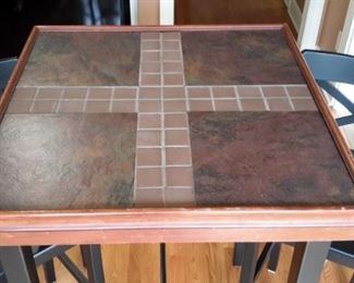 Tiled pub table and 2 chairs.