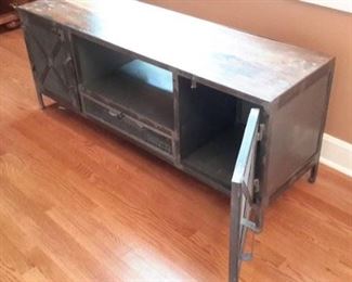 Rustic tv stand/entertainment center. Wood with metal doors.