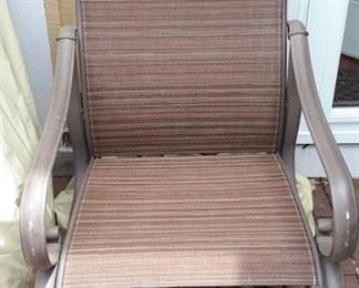 4 rocker/swivel patio chairs with like-new strap-down covers that won't blow away!