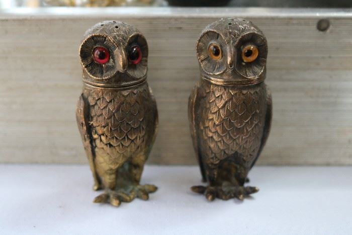 brass pair of table shakers with glass eyes