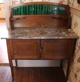 Vintage porphyry topped dry sink with glazed tile insert