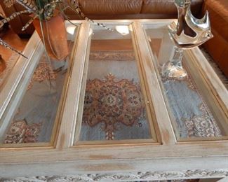 Living room coffee table with heavy leaded glass top.