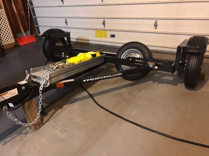 Eze-Tow Dolly - never used                                                                   Surge Disc Brakes, Spare Tire, Hold down straps,                  Safety chains, Loading ramps - requires 2" ball - $1500