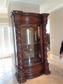 Important Henredon lighted display with curved glass door and multiple shelves