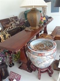 Long trestle table. Lamps, planters, etc.