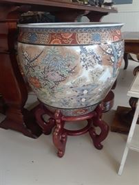 Huge porcelain pot on stand