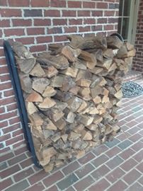 Stack of fire wood plus metal holder