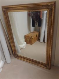 Large mirror with gold leaf frame