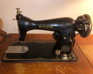 Antique Raico sewing machine and cabinet
