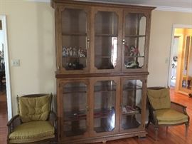 Huge display cabinet with shelving. Matching vintage chairs.