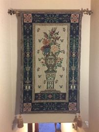 Nice tapestry with decorative hanging rod.