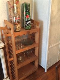 Cool wine rack, vintage Smirnoff and Heinekin bottles.