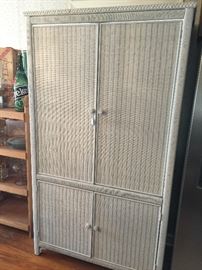 White rattan armoire.
