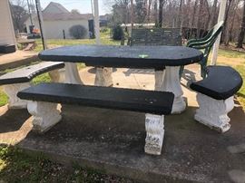 large concrete picnic table and benches