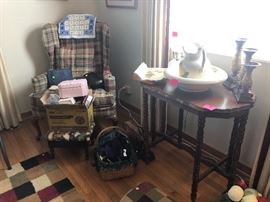 wing back chair, vintage wooden table, candle sticks