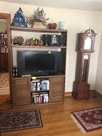 tv, grandfather clock, small stereo, entertainment center