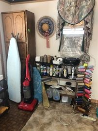 large spools of thread, irons, upright vacuum