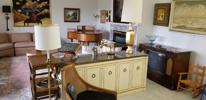 Mid-century furniture and baby grand piano.